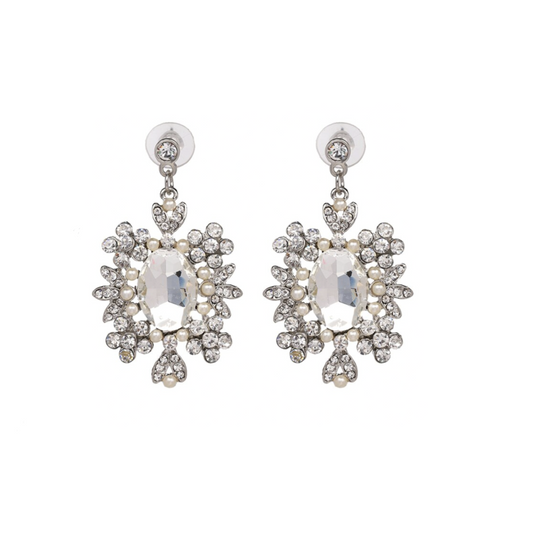 Boucles d'oreilles pendantes argentées cristal strass incolore et perles. Détails produit : Couleur argent. Métal argenté. Cristal strass.